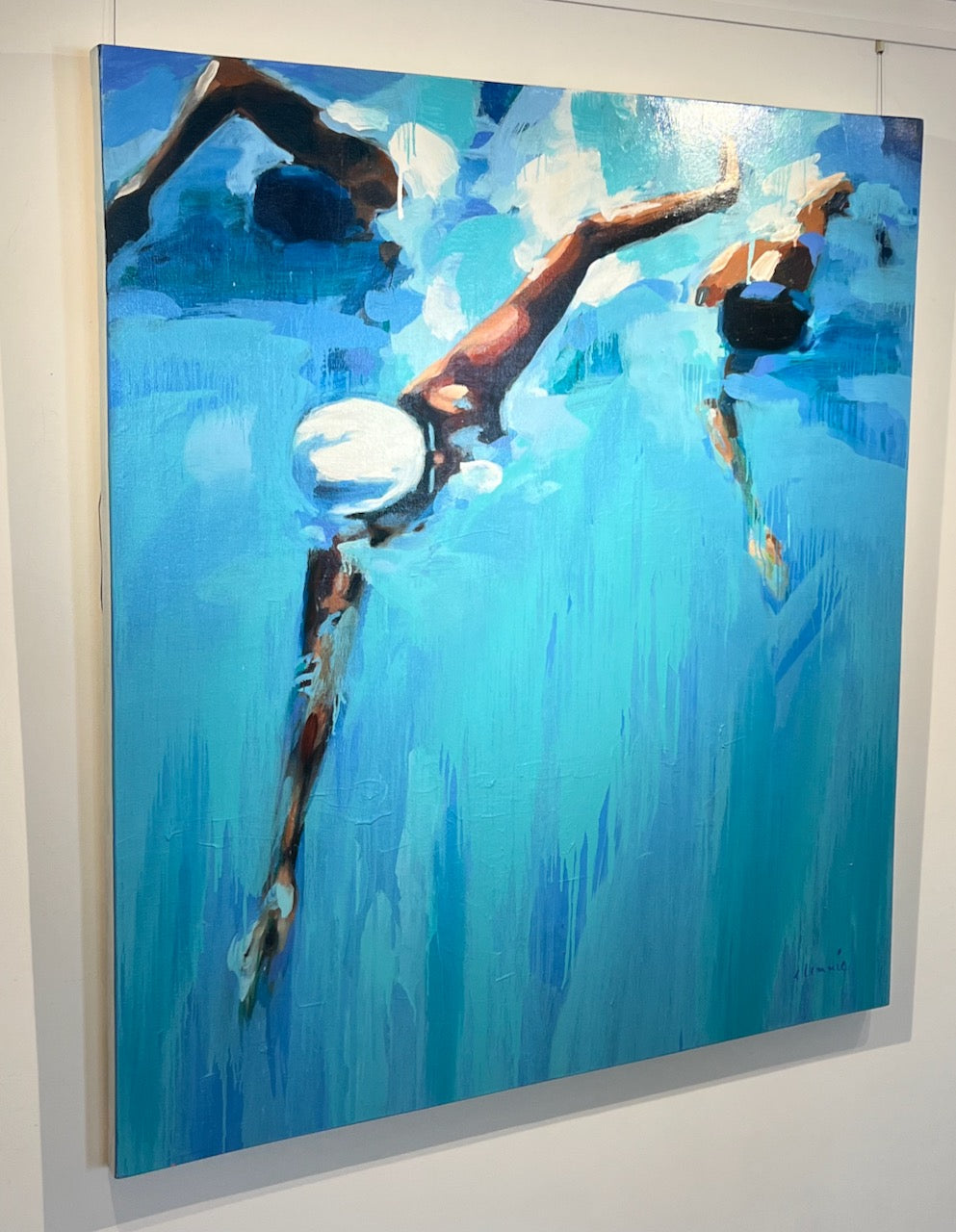 large scale abstract oil painting of competitive swimmers in blue water
