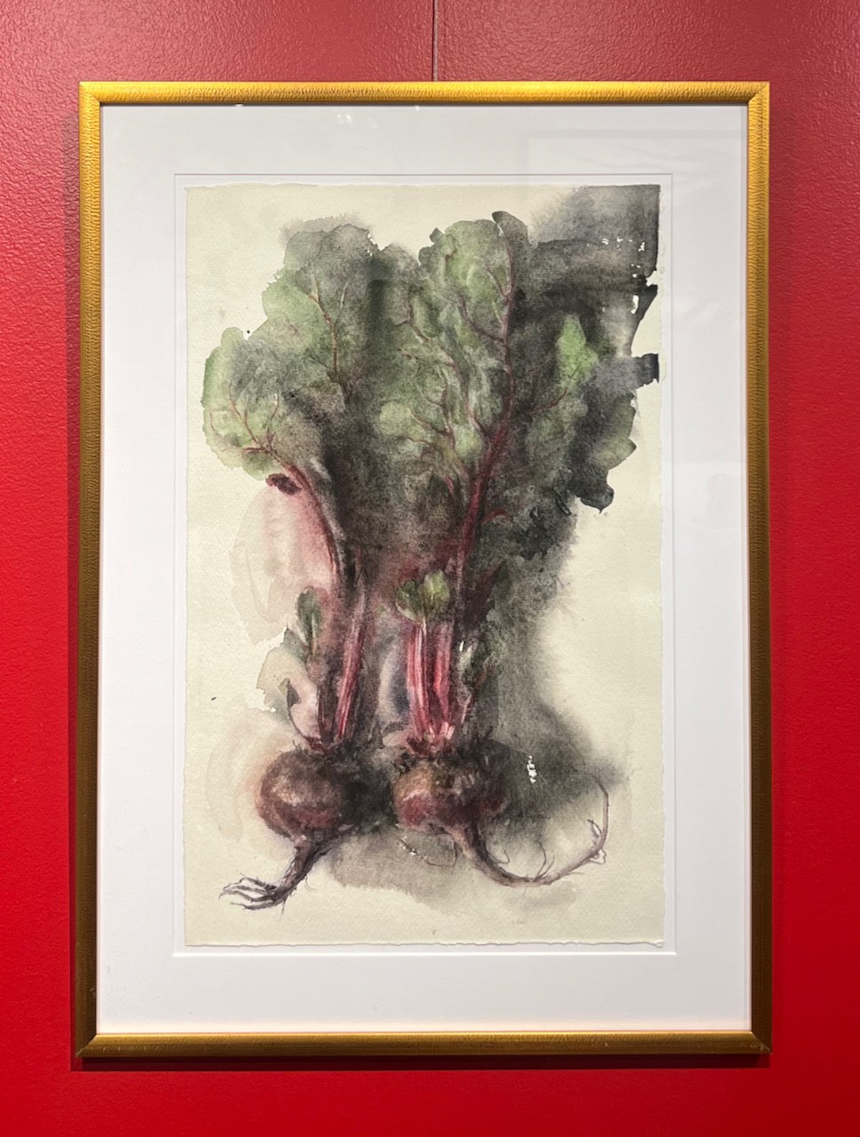 Still Life watercolor painting by Wendy Artin of deep red beets and dark green leaves