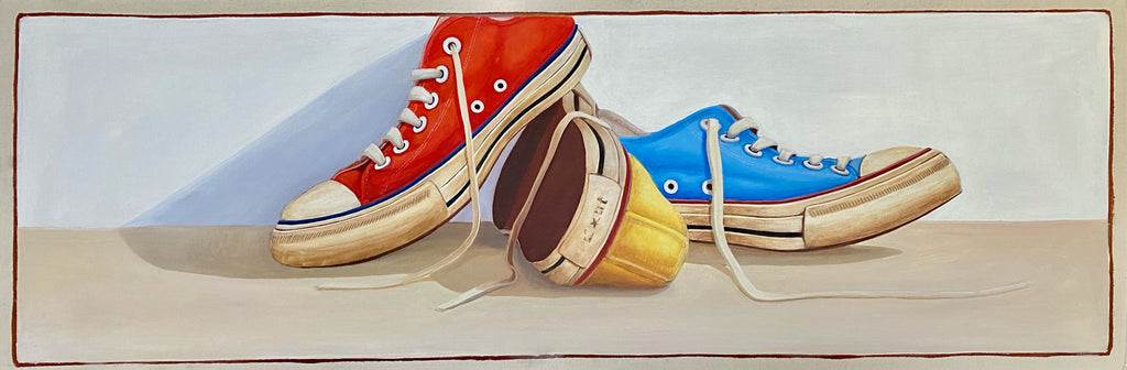 horizontal oil painting of red, yellow, and blue low top converse sneakers on two shades background 