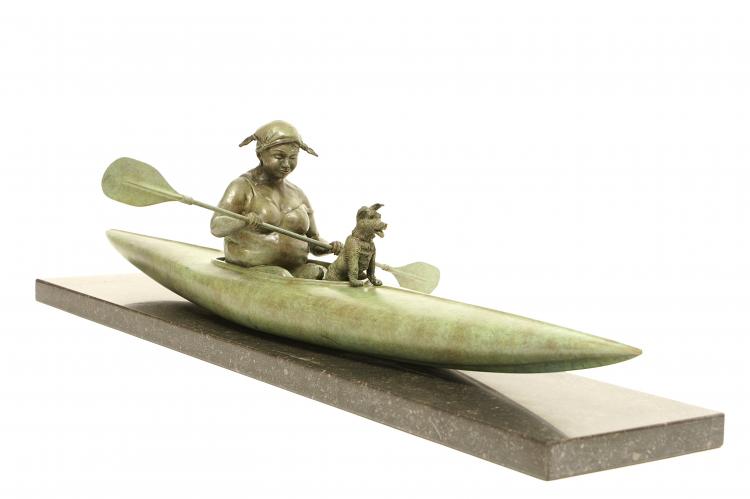 bronze sculpture of a plus size woman kayaking with a small dog on now of ship
