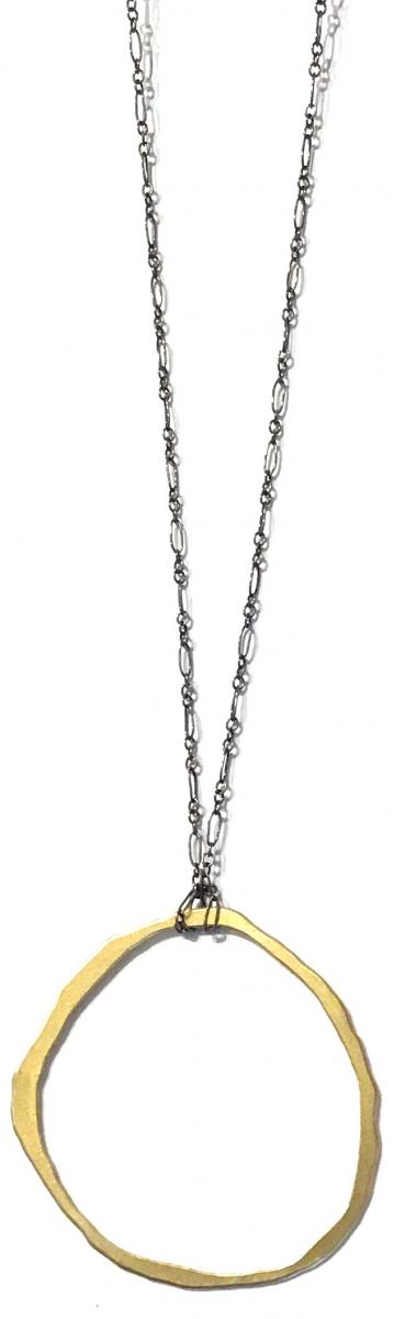 Lisa crowder necklace with oxidized silver chain and large rough cut vermeil open-circle pendant