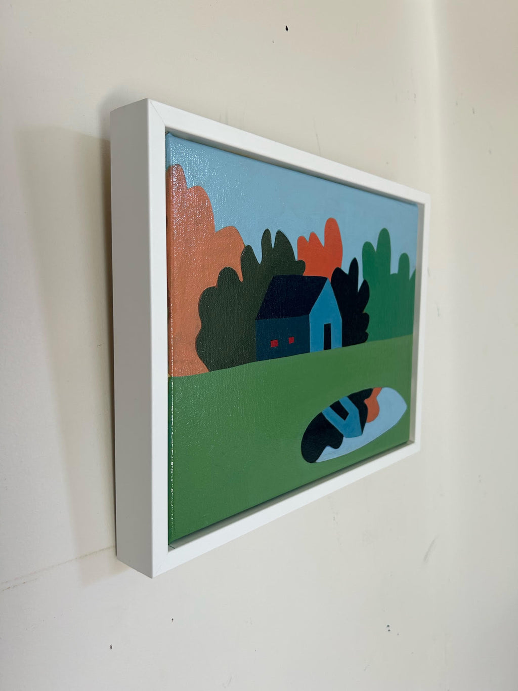 small scale contemporary oil painting of  a blue house with green, orange and black forest behind