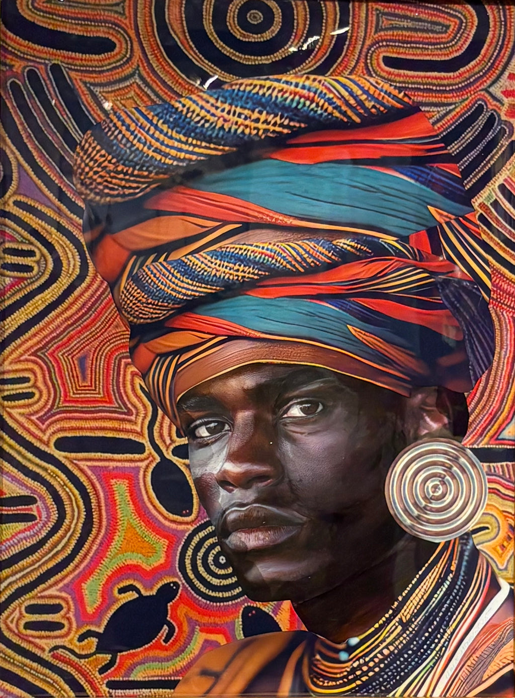 portrait of a man looking forward, with a colorful headdress and necklaces. He is contrasted against lively patterns
