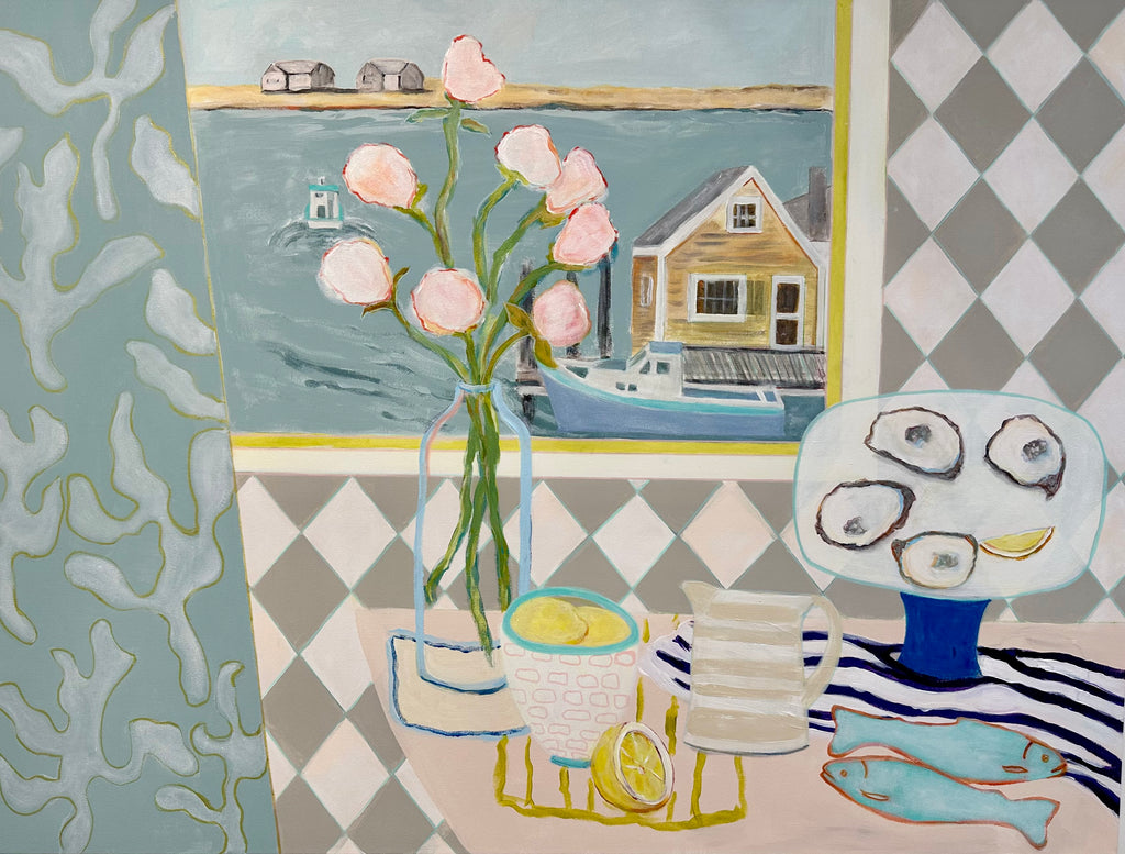 Still life of a tabletop garnished with oysters and lemon. The kitchen overlooks a boathouse in the shore
