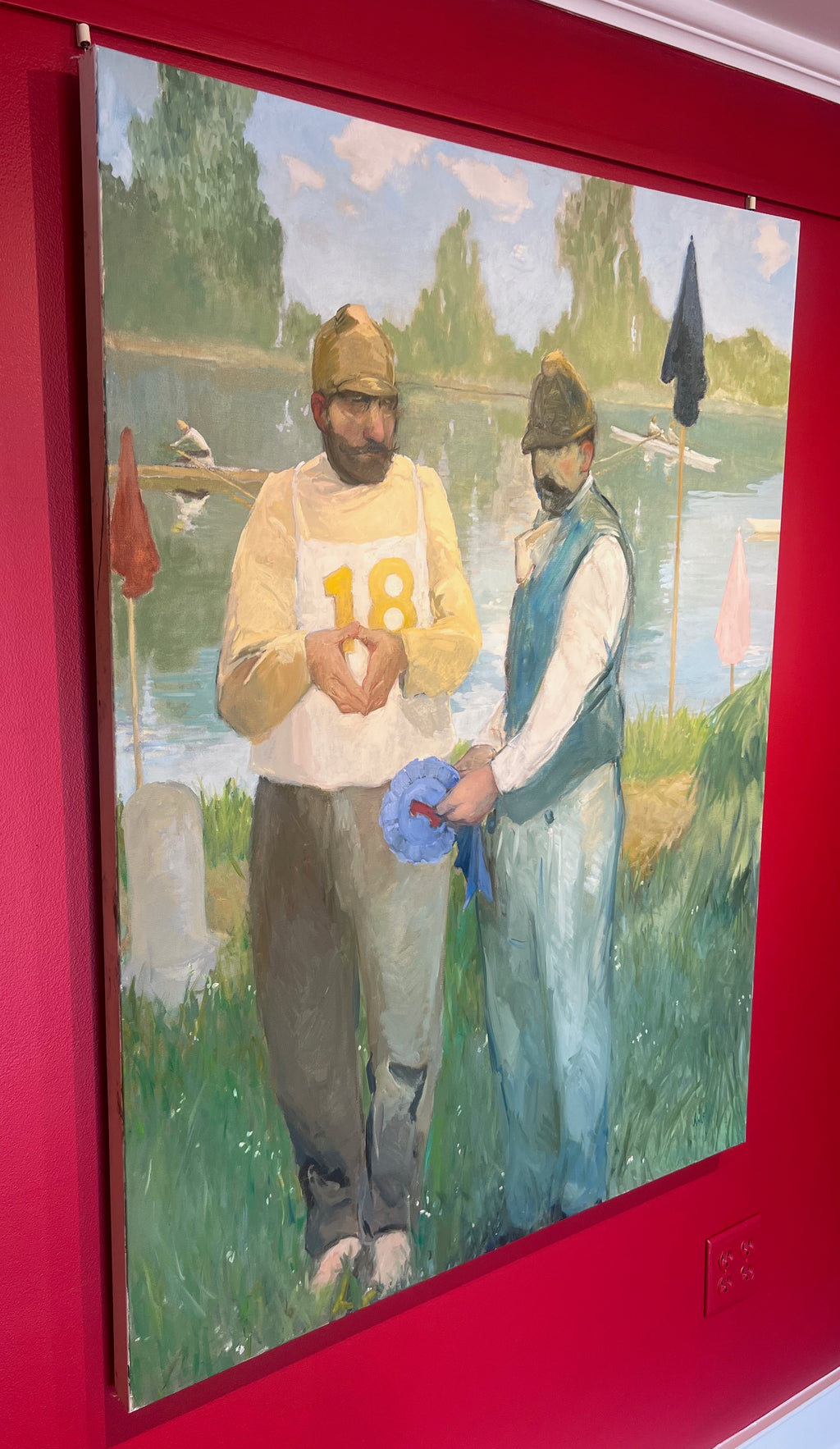 Oil painting of two men holding first place award by the lake