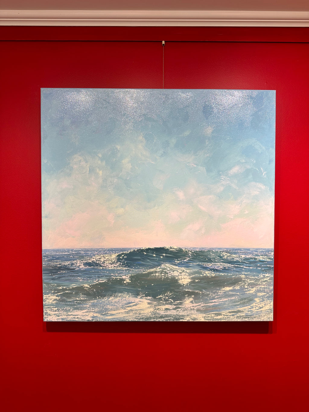 oil painting of waves in glistening ocean with light pink and blue sky with clouds, seascape
