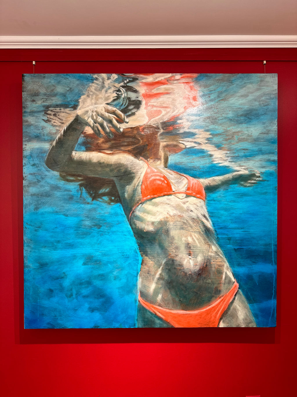 Underwater oil painting of a woman in a pink bikini treading water with water ripple details