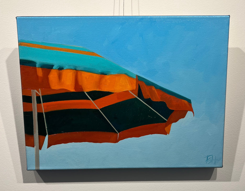 small scale oil painting of orange and turquoise umbrella with blue sky behind