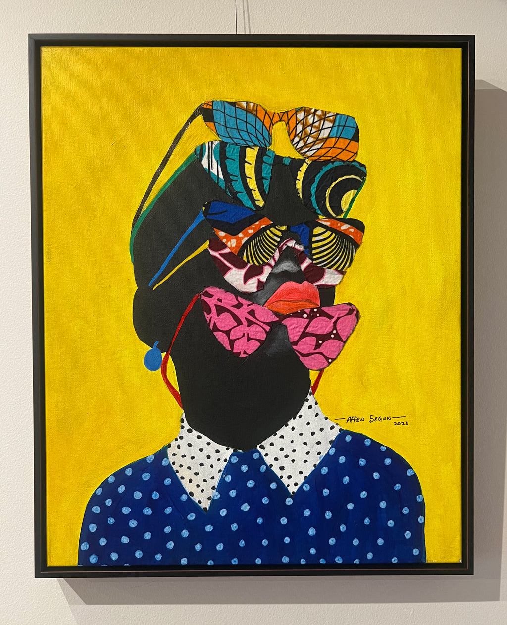 Colorful portrait of a young Black woman wearing African print sunglasses