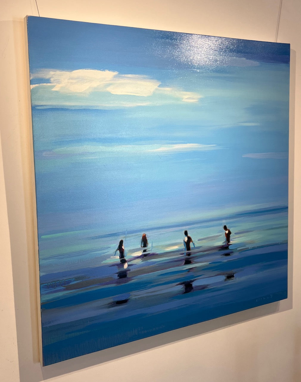 square abstract oil painting of people standing in blue water with blue sky and clouds