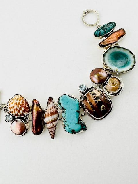 "Limpet, conus & spiral shell, bronze pearl, blue topaz, turquoise bracelet"