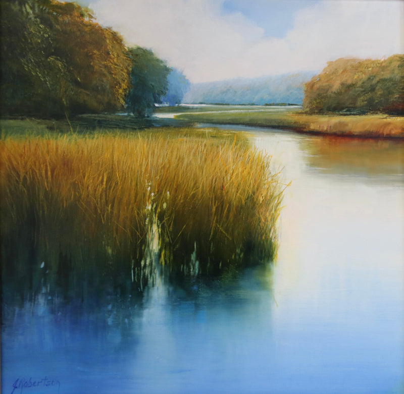 Marsh scene reflecting on blue water
