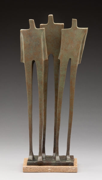 three figures standing up straight, near eachother