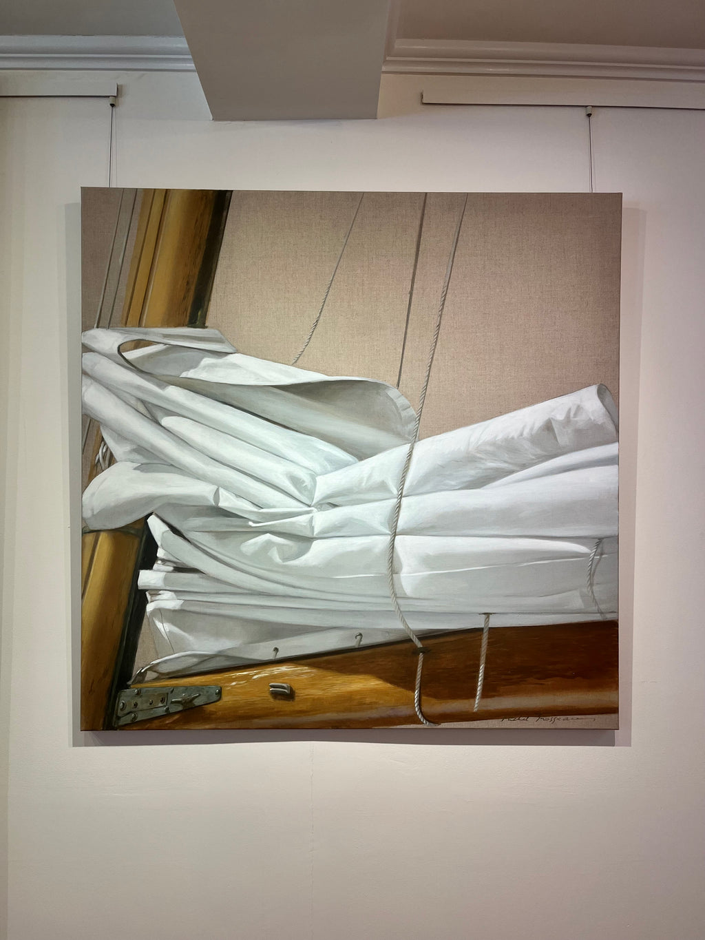 photorealist oil painting of a folded white sail with linen background