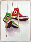 Still life oil painting by Santiago Garcia of a red, green, and pink converse sneaker hanging by shoe laces on a white shadowed canvas