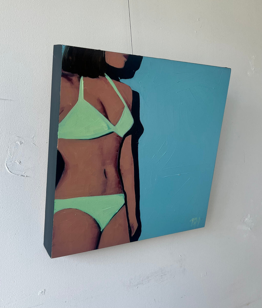 Oil on canvas painting of a woman in a green bikini against a blue wall. The woman's face is in profile and only to the lips..