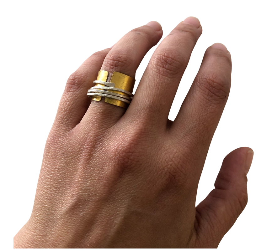 22k gold and sterling silver bi-metal band with sterling silver wrapped wire. Band is 5/8" wide. Size 6 & 1/2.