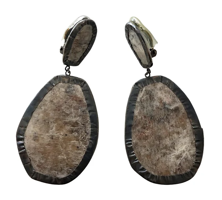Oxidized silver wraps lavender mica in this light and bold statement clip on earring. 3 & 1/4" long x 1 & 1/2" wide”.