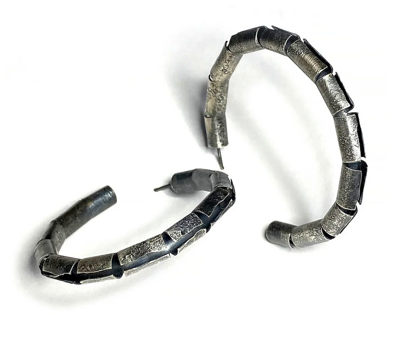 Oxidized sterling silver open tube hoop earring. 1.5" in diameter. 