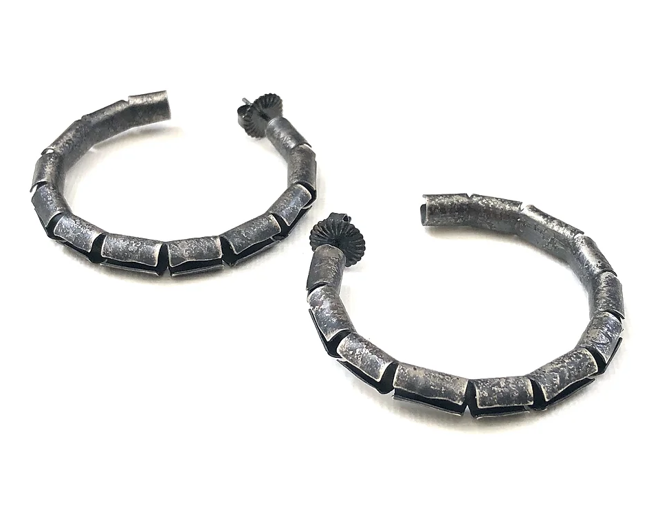 Oxidized sterling silver open tube hoop earring. 1.5" in diameter. 