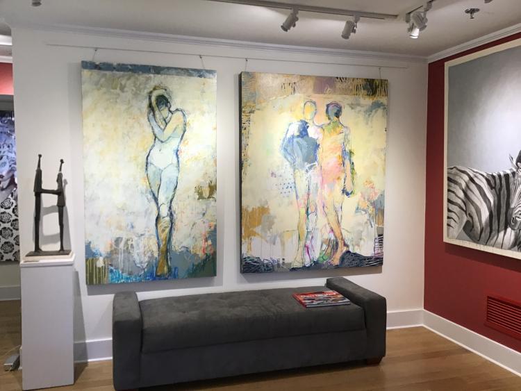 Abstract mixed media painting by Jylian Gustlin of two figures in yellow, pink, blue, and cream 