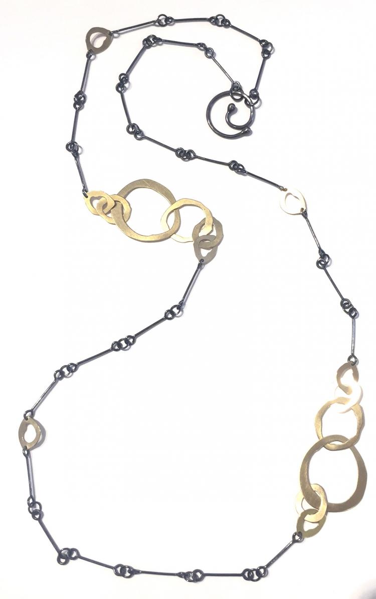 Long mixed metal necklace by Lisa crowder with oxidized silver chain and vermeil jumbles