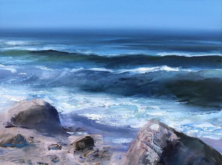 Oil painting by Whitney Knapp of the deep blue ocean shore with large rocks and choppy water