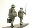 Bronze sculpture by Veronique Clamot of two plus size women walking with fishing gear in hands
