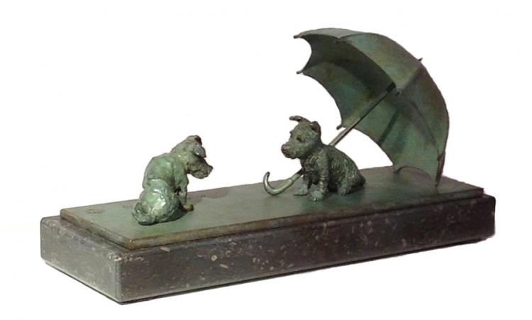 Bronze sculpture by Veronique Clamot of two small dogs and one is under an umbrella